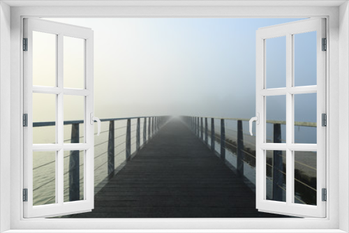 Fototapeta Naklejka Na Ścianę Okno 3D - Empty footbridge in the morning fog.