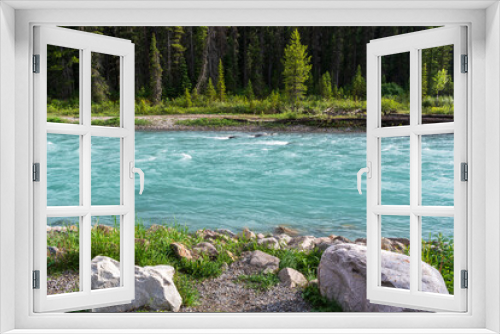 Fototapeta Naklejka Na Ścianę Okno 3D - Tranquil Green River Flows Through Kootenay National Park, Canada