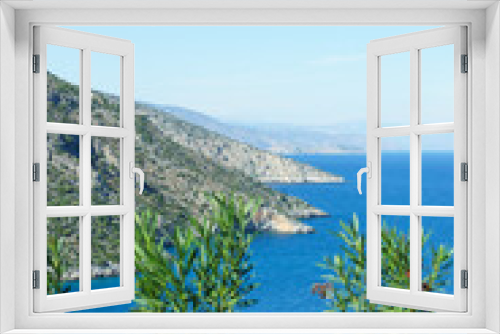 Fototapeta Naklejka Na Ścianę Okno 3D - Summer time in Greece. Beautiful Greek coastline next to sea shore during warm weather.