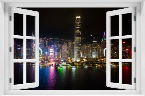 Fototapeta Naklejka Na Ścianę Okno 3D - Hong Kong Island skyline at night, Hong Kong skyline from drone, Symphony of Lights, Hong Kong's Symphony of Lights from Tsim Shai Tsui promenade. 