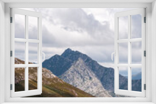 Fototapeta Naklejka Na Ścianę Okno 3D - dramatic mountain view with sky, clouds and rugged peaks in a mountainous landscape in the fynbos cape mountains of South Africa