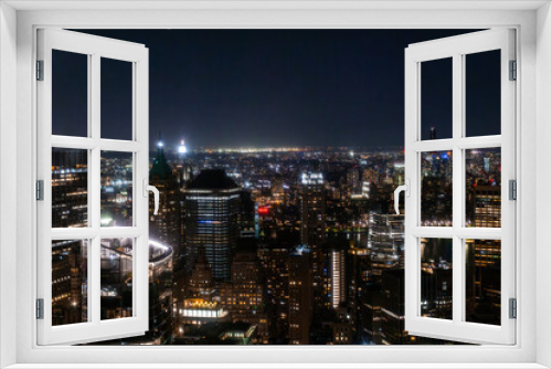 Fototapeta Naklejka Na Ścianę Okno 3D - New York City Aerial Night Cityscape with Stunning Manhattan Landmarks, Skyscrapers and Residential Buildings. Wide Angle Panoramic Helicopter View of a Popular Travel Destination