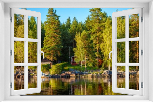 Fototapeta Naklejka Na Ścianę Okno 3D - Forest reflecting in lake