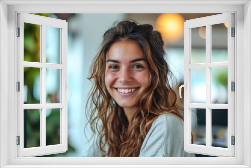 Smiling young woman working in the office at the computer. Generative AI.