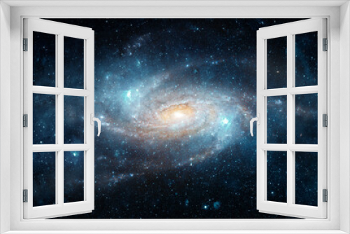 Fototapeta Naklejka Na Ścianę Okno 3D - A view from space to a spiral galaxy and stars. Universe filled with stars, nebula and galaxy,. Elements of this image furnished by NASA.