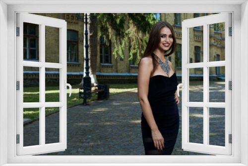 sexy woman in black dress and necklace