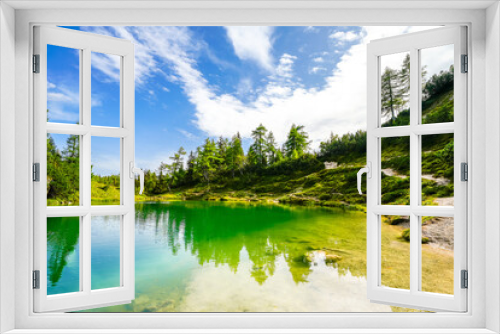 Fototapeta Naklejka Na Ścianę Okno 3D - Fairy tale lake on the high plateau of the Tauplitzalm. View of the lake at the Totes Gebirge in Styria. Idyllic landscape with mountains and a lake on the Tauplitz.
