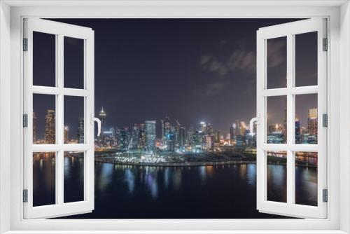 Fototapeta Naklejka Na Ścianę Okno 3D - Aerial view to Dubai Business Bay and Downtown with the various skyscrapers and towers night timelapse