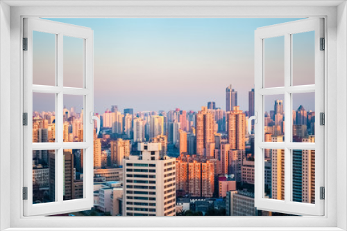 Fototapeta Naklejka Na Ścianę Okno 3D - modern city at dusk
