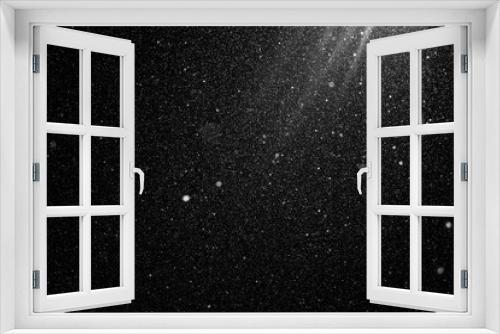 Fototapeta Naklejka Na Ścianę Okno 3D - Floating dust particles. White dust  texture on a black background. Snowflakes falling at night from the sky. Great Dust speckle texture background. 
