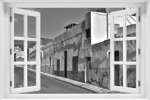 Fototapeta Naklejka Na Ścianę Okno 3D - Black and white image of alleyways in Agüimes on Grand Canary