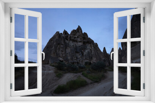 Fototapeta Naklejka Na Ścianę Okno 3D - Valley with cave houses in cappadocia in the evening