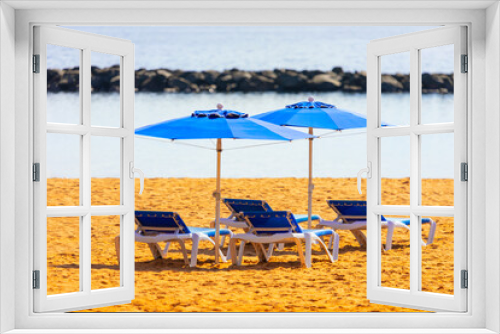 Fototapeta Naklejka Na Ścianę Okno 3D - Beach umbrellas and sun loungers on the sunny coast