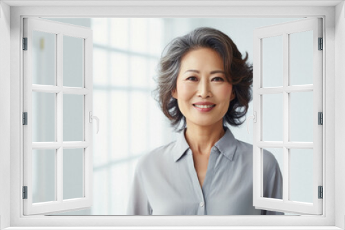 Smiling woman wearing white dress and white shirt