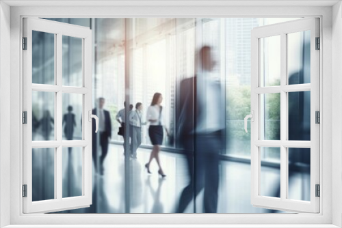 Dynamic corporate atmosphere: blurred silhouettes of professionals in a modern white glass office setting