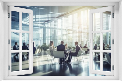 Dynamic corporate collaboration: blurred business professionals in contemporary office conference room setting