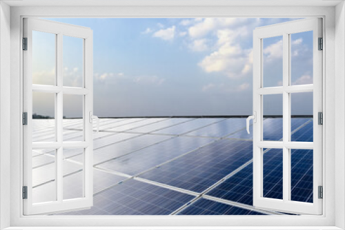 Fototapeta Naklejka Na Ścianę Okno 3D - Photovoltaic or solar rooftop panels, new technology to store and use the power from the nature with human life, sustainable energy and environmental friend concept.