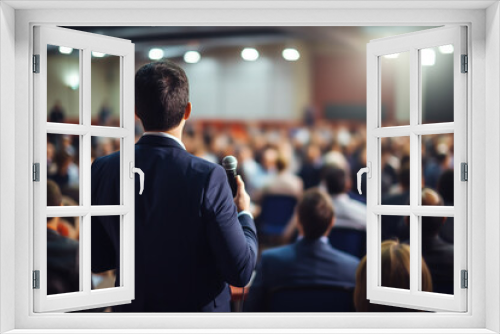 Businessman Giving a Speech on Stage during a Seminar