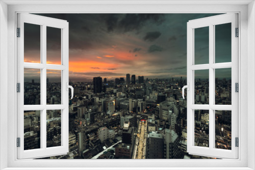 Fototapeta Naklejka Na Ścianę Okno 3D - Ville Japonaise vue de haut au couché du soleil