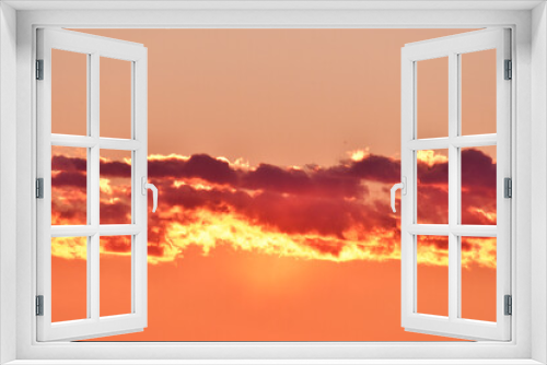 Fototapeta Naklejka Na Ścianę Okno 3D - Nuvole infuocate al tramonto