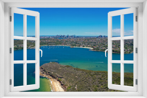 Fototapeta Naklejka Na Ścianę Okno 3D - High angle aerial drone view of Balmoral Beach and Edwards Beach in the suburb of Mosman, Sydney, New South Wales, Australia. CBD, North Sydney in the background, Grotto Point in the foreground.