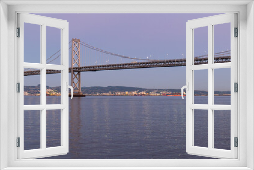 Fototapeta Naklejka Na Ścianę Okno 3D - Sunset View of the San Francisco Bay Bridge from the Piers