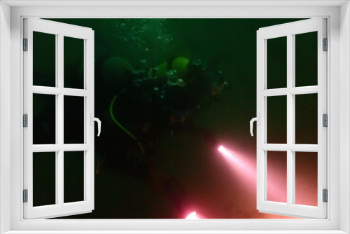 Fototapeta Naklejka Na Ścianę Okno 3D - Scuba divers in a merky lake in Switzerland