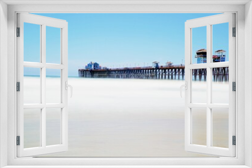 Fototapeta Naklejka Na Ścianę Okno 3D - Langes Holzpier an Ozean