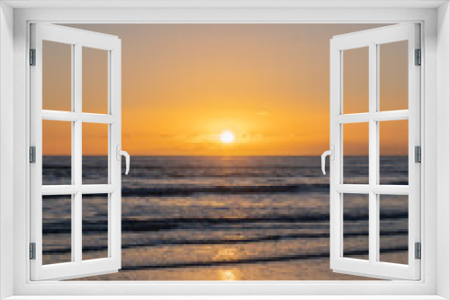 Fototapeta Naklejka Na Ścianę Okno 3D - Mesmerizing beach sunset with vibrant colors, tranquil waves, and coastal beauty, ideal for relaxation, travel, golden skies