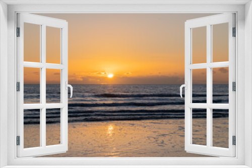 Fototapeta Naklejka Na Ścianę Okno 3D - Mesmerizing beach sunset with vibrant colors, tranquil waves, and coastal beauty, ideal for relaxation, travel, golden skies