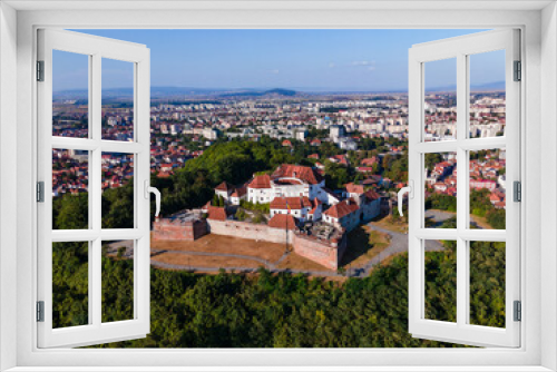 Fototapeta Naklejka Na Ścianę Okno 3D - Landscape photography of the modern star shaped fortification in Brasov, Romania. Photography was taken from a drone at a higher altitude with camera level for a panoramic still of the bastion.