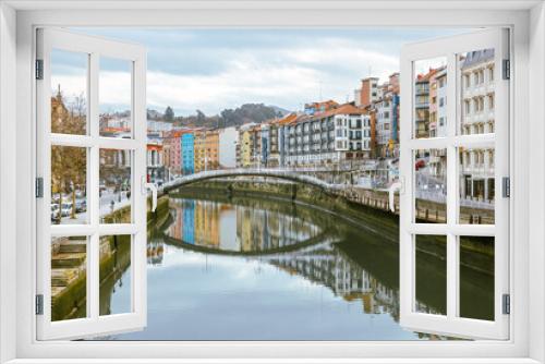 Fototapeta Naklejka Na Ścianę Okno 3D - Bilbao, Spain - January 2, 2024: Architectural details of buildings along the Nervion River in Bilbao, Spain
