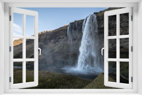 Fototapeta Naklejka Na Ścianę Okno 3D - view of the shaded waterfall complex Seljalandsdoss, Iceland