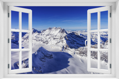 Fototapeta Naklejka Na Ścianę Okno 3D - Mountain peaks chain in Jungfrau region helicopter view in winte