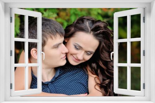 the love of man and woman in the park, woman hugging guy