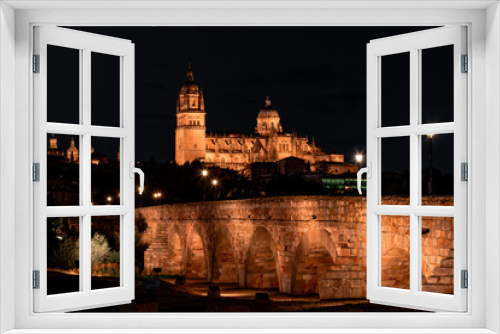 Fototapeta Naklejka Na Ścianę Okno 3D - Night view of Salamanca cathedral and Roman bridge over Tormes river , Salamanca, Spain.