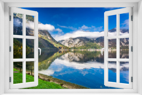Fototapeta Naklejka Na Ścianę Okno 3D - Mountain lake between by mountains