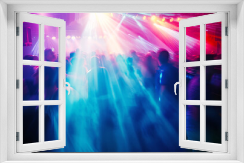 Blurred Dance Floor with Colourful Lights.
A motion-blurred scene of a vibrant dance floor lit with dynamic, colourful lights. 