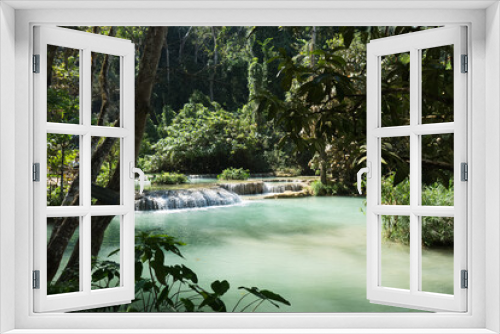 Fototapeta Naklejka Na Ścianę Okno 3D - Tranquil cascade in a lush green forest