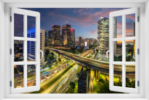 Fototapeta Naklejka Na Ścianę Okno 3D - Panoramic view of jakarta City, Indonesia, with beautiful sunset. Jakarta is the largest city in indonesia that also the center of governance and business district. 