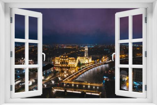 Fototapeta Naklejka Na Ścianę Okno 3D - Midnight Symphony: Mesmerizing Aerial View of Oradea, Romanias Enchanting Cityscape Illuminated by Night Lights