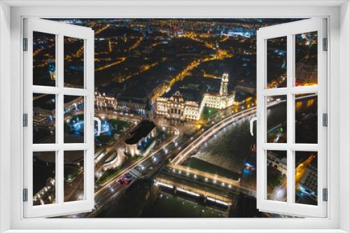 Fototapeta Naklejka Na Ścianę Okno 3D - Luminescent Symphony: Captivating Aerial Glimpse of Oradea, Bihor, Romanias Vibrant Night Cityscape