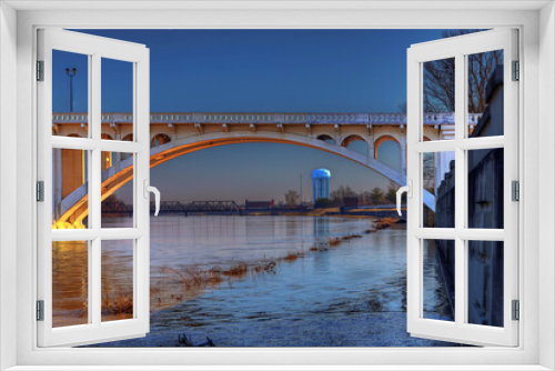 Fototapeta Naklejka Na Ścianę Okno 3D - Wabash River Through the Lincoln Memorial Bridge.. A view of the Wabash River and the Vincennes University Water Tower through the Lincoln Memorial Bridge.  