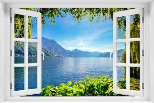 Fototapeta Naklejka Na Ścianę Okno 3D - View of Traunsee and the surrounding landscape. Idyllic nature by the lake in Styria in Austria. Mountain lake at the Dead Mountains in the Salzkammergut.
