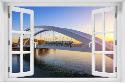 Fototapeta Naklejka Na Ścianę Okno 3D - Tramway on the bridge at sunset