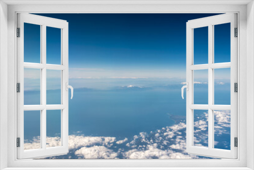 Fototapeta Naklejka Na Ścianę Okno 3D - view from the airplane window landscape above the clouds