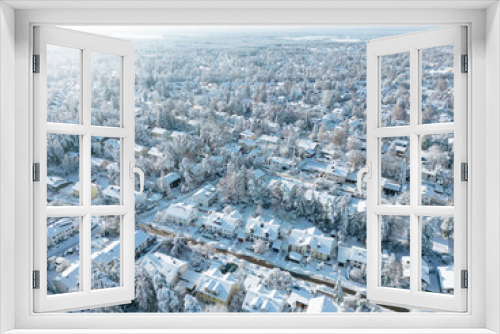 Fototapeta Naklejka Na Ścianę Okno 3D - Snow-covered suburban houses seen from above