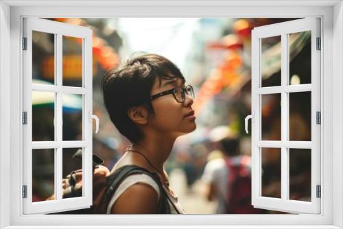 Young Asian backpacker in Bangkok outdoor market.