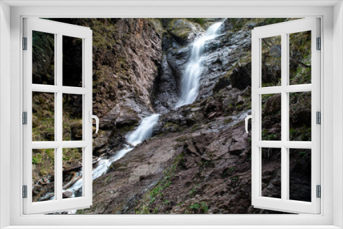 Fototapeta Naklejka Na Ścianę Okno 3D - Beautiful waterfall in the mountains. A mountain river flows down. Beautiful nature. Stones and water.