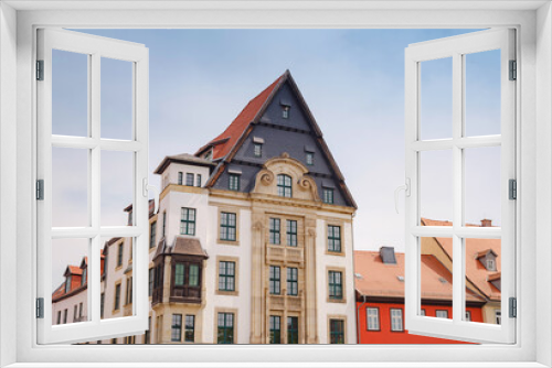 Fototapeta Naklejka Na Ścianę Okno 3D - spring trip to Europe. Travel and German sightseeing locations. scenic view to facade of old historic houses somewhere in Erfurt city, Traditional half-timbered houses makes cozy and fairy tail mood